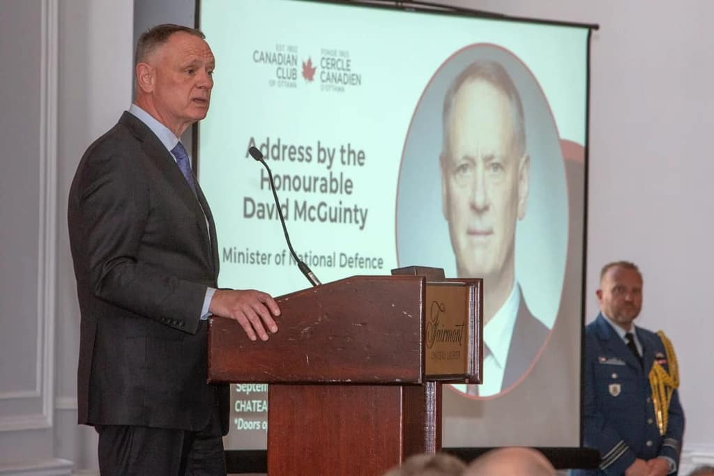 Minister David McGuinty at the podium